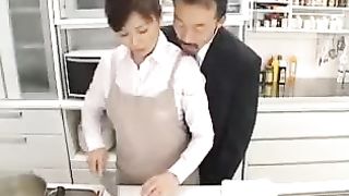 Asian store worker is no longer showing off the goods for sale, but other kinds of goods