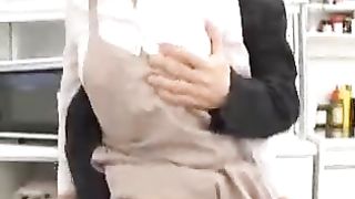 Asian store worker is no longer showing off the goods for sale, but other kinds of goods